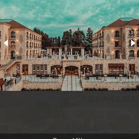 Buona Vitta Gramado Resort & Spa By Gramado Parks Exteriör bild The photo shows a spacious and elegant building design, likely a hotel or resort. The structure features multiple stories and large windows, with outdoor seating areas visible on a terrace or patio. The exterior has a combination of stone and modern 